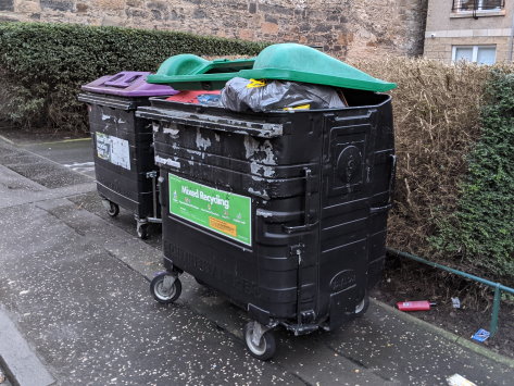 "A full recycling bin near my flat"